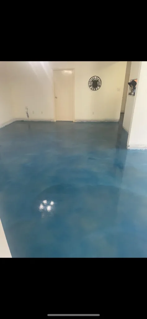Stained concrete floor, blue finish, interior