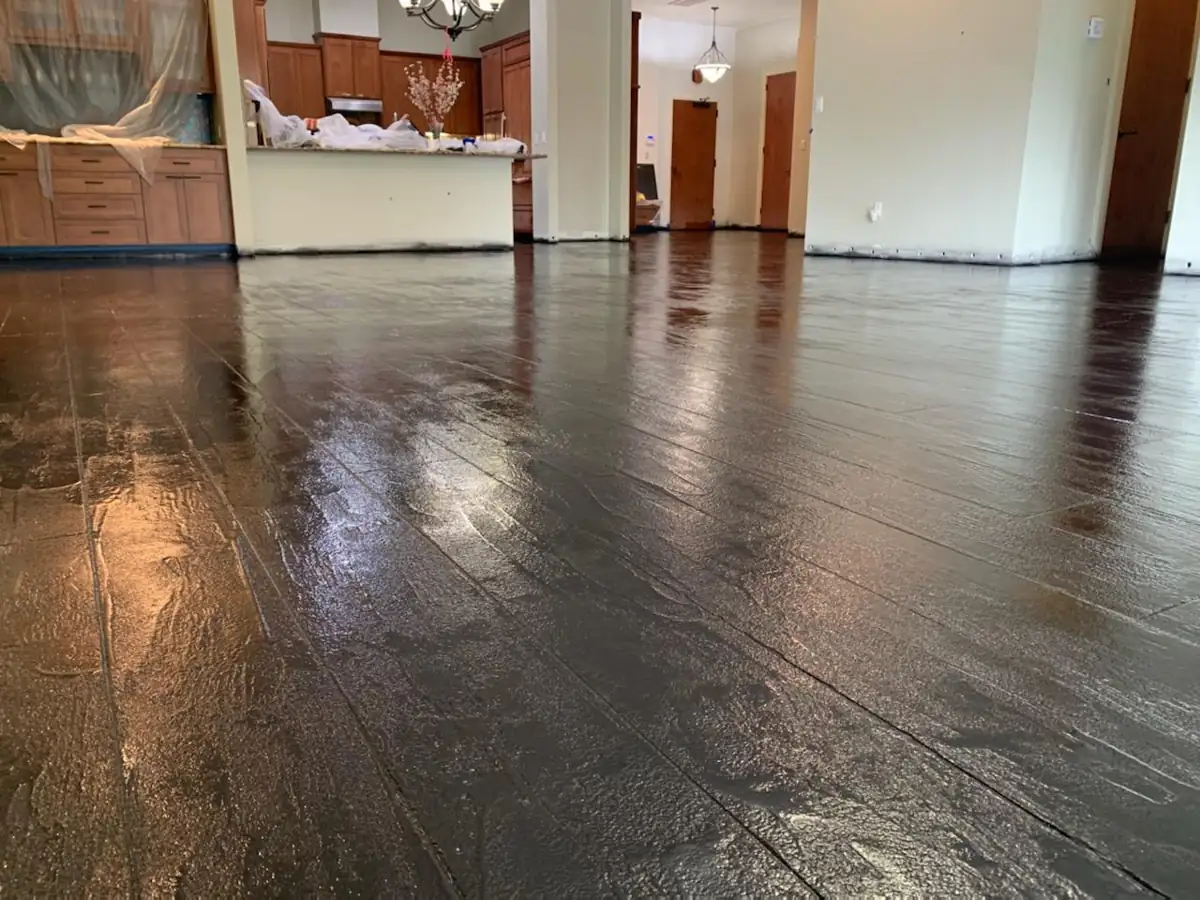 Stained stamped concrete floor, dark plank look, kitchen