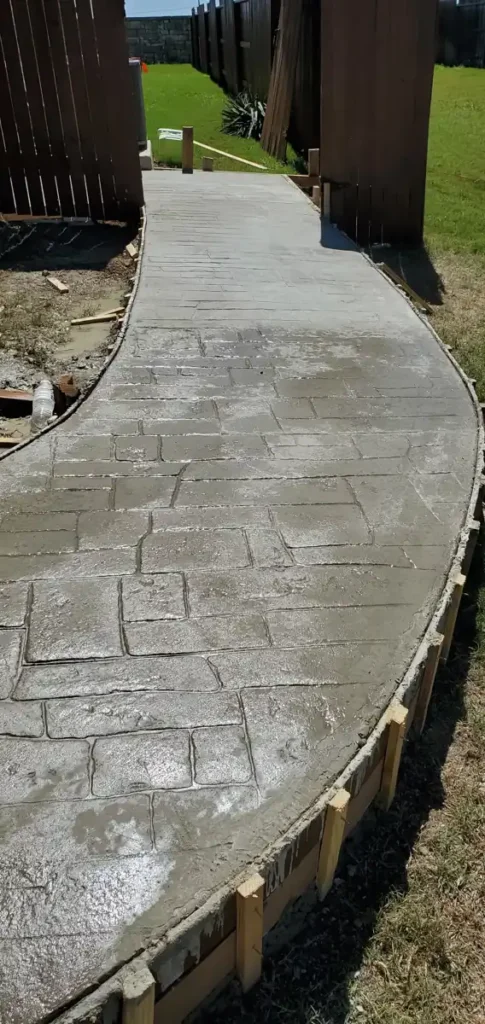 Stamped concrete walkway, curved, stone pattern