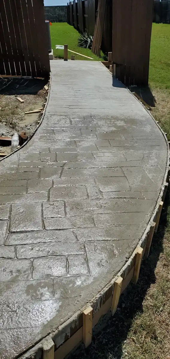 Stamped concrete walkway, curved, stone pattern